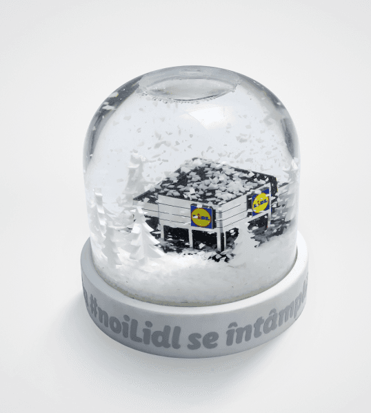 Custom snow globe with a miniature branded building